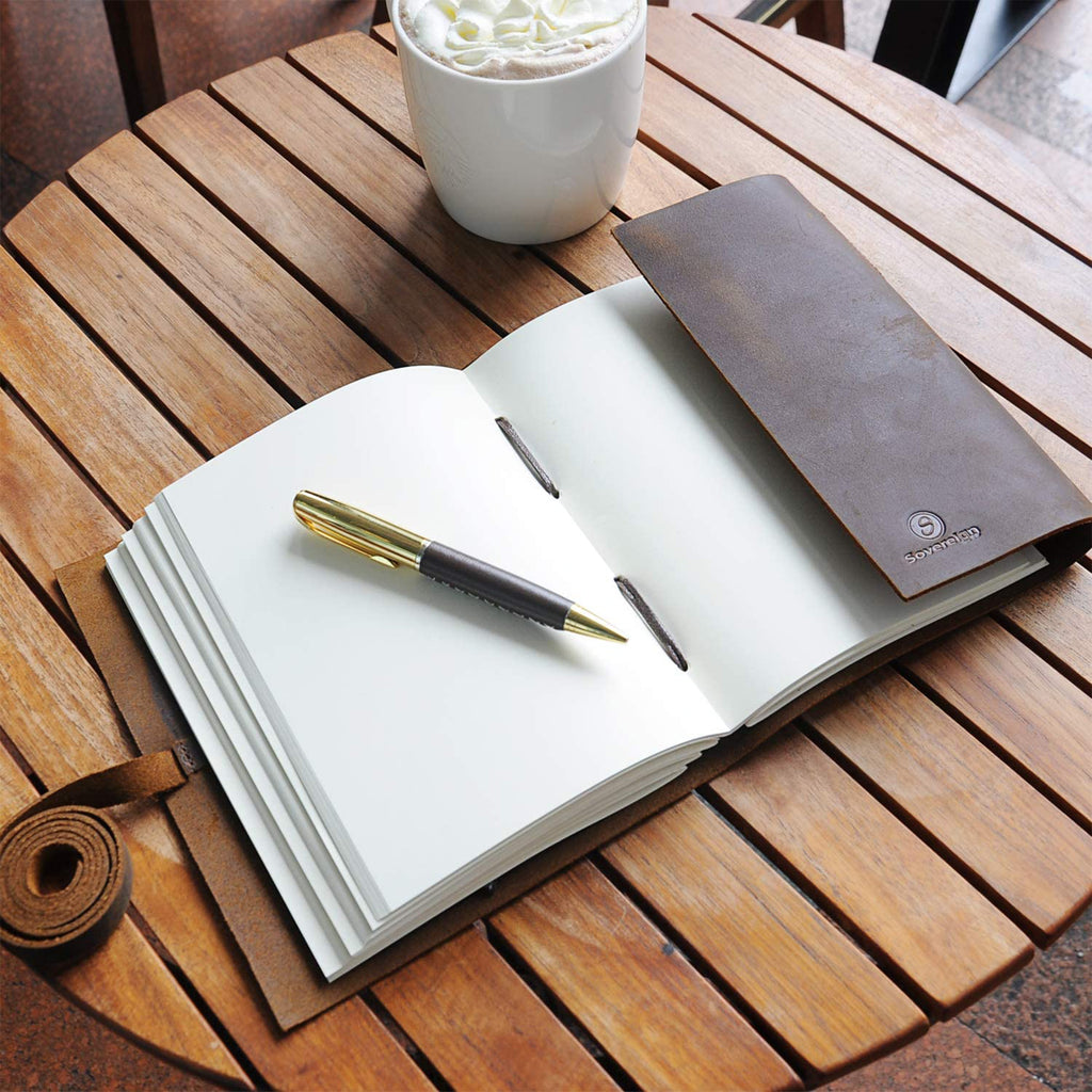 Leather Journal Open on Desk with Pen and Sovereign-Gear Logo